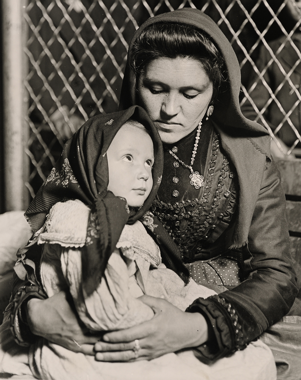 An Italian mother and child who have just arrived at Ellis Island along with hundreds of other immigrants in search of a better life, 1905. Photograph by Lewis Wickes Hine. Wikimedia Commons.