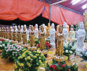 A photograph of rows of Buddha statues.