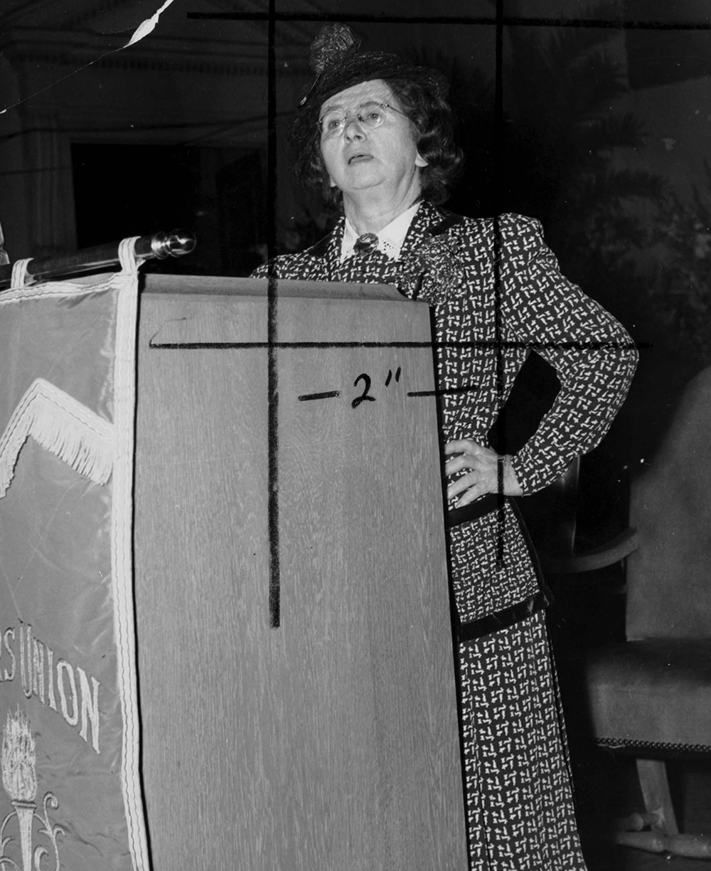 Rose Schneiderman speaks at a banner-draped podium. The Kheel Center for Labor-Management Documentation and Archives, International Ladies Garment Workers Union Photographs.