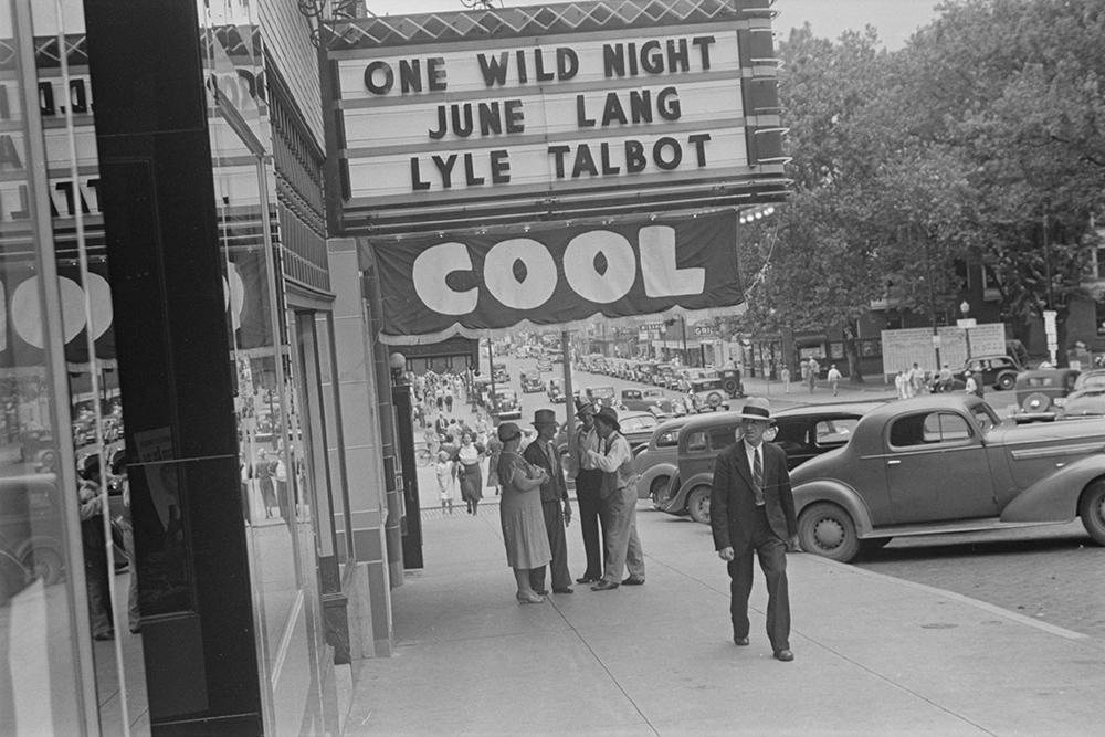 Photograph of a street scene showing a movie theater, probably in the vicinity of Lancaster, Ohio, by Ben Shahn, 1938.