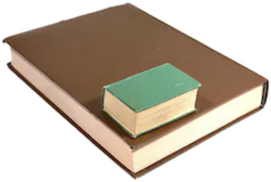 A small hardcover book on top of a large book