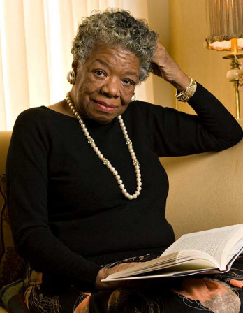 Maya Angelou Woman with short gray hair seated with a book open in her lap