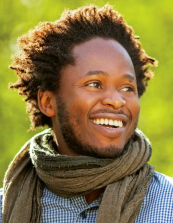Color photograph of writer and activist Ishmael Beah.