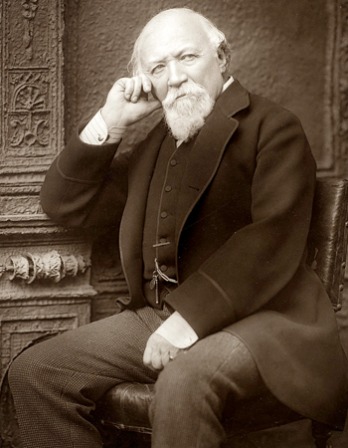 Black and white photograph of English poet Robert Browning seated.