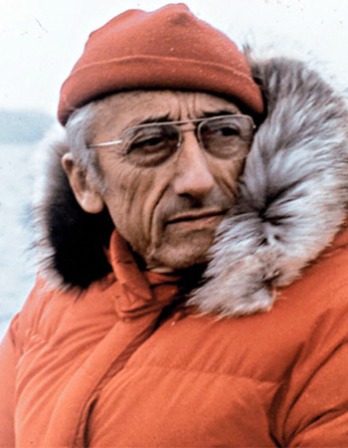 Color photograph of French oceanic explorer Jacques Cousteau in parka.