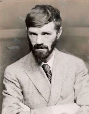 Black and white photograph of D.H. Lawrence with arms crossed.