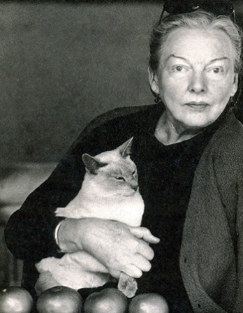 Photograph of American food writer M.F.K. Fisher with cat.