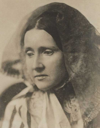 Sepia image of a woman with head veiled