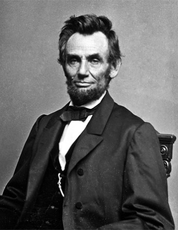 Photograph of President Abraham Lincoln sitting in a chair.