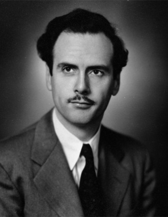 Black and white photograph of a young Marshall McLuhan with a think mustache.