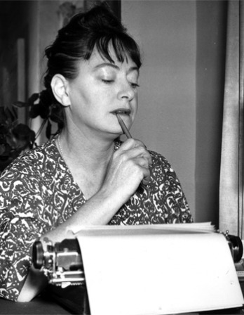 Dorothy Parker working at her typewriter.