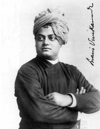 Black and white photograph of a man in a turban with his arms crossed