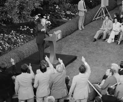 President Gerald Ford taking questions from reporters during a press conference at the White House, 1975. Photograph by Marion S. Trikosko.