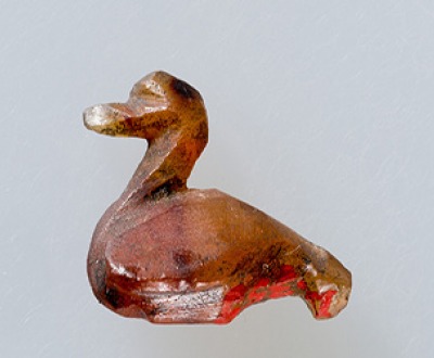 Duck amulet.