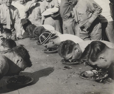 Marines stationed in North China participate in a pie-eating contest, c. 1941. Ray S. Robinson Collection (COLL/1940), U.S. Marine Corps Archives & Special Collections.