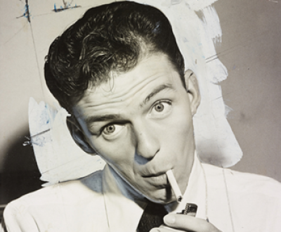 Frank Sinatra lighting a cigarette, 1944.
