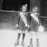 Photo showing two young girls on roller skates wearing sashes that read, “Don’t Be a Scab.”