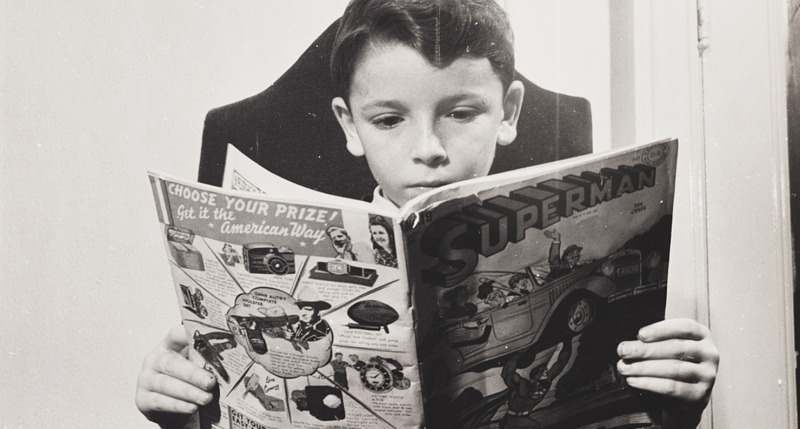 A German refugee child reads a Superman comic, 1942
