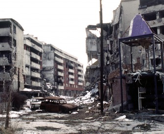 View of Grbavica, a neighbourhood of Sarajevo, approximately 4 months after the signing of the Dayton Peace Accord that officially ended the war in Bosnia, 1996. Photograph by Lt. Stacey Wyzkowski. 