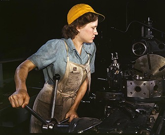Lathe operator machining parts for transport planes at the Consolidated Aircraft Corporation plant, Fort Worth, Texas