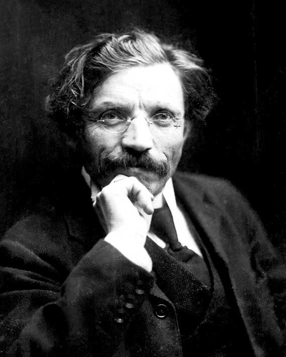 Sholem Aleichem Black and white photograph of a mustached man wearing glasses with his hand under his chin