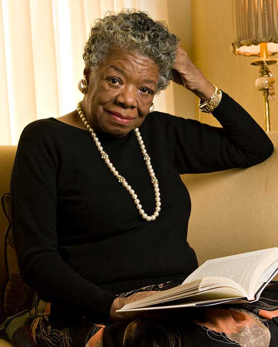 Maya Angelou Woman with short gray hair seated with a book open in her lap
