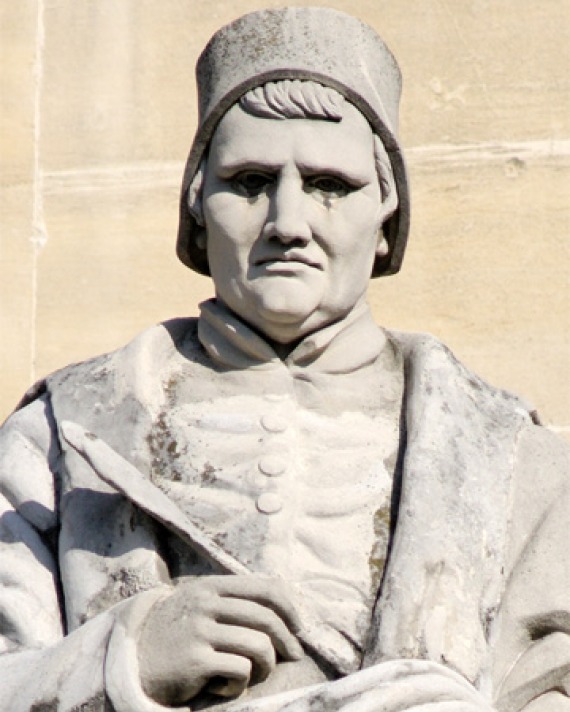 Statue of French medieval poet and historian Jean Froissart.