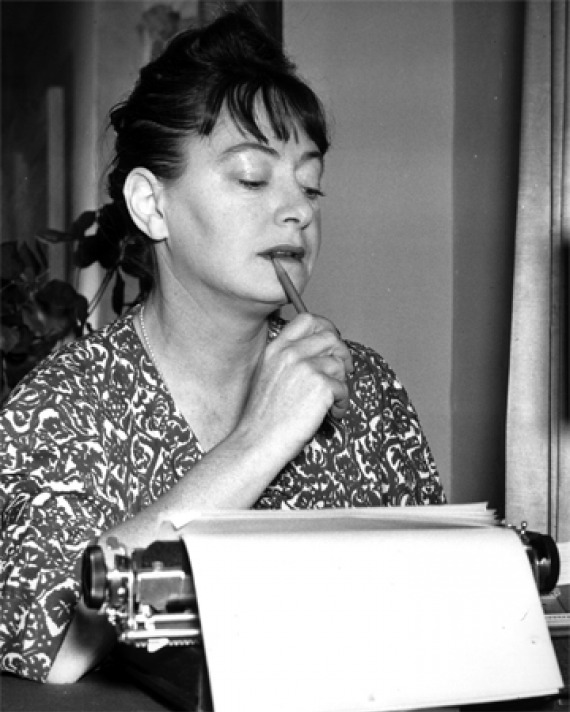 Dorothy Parker working at her typewriter.