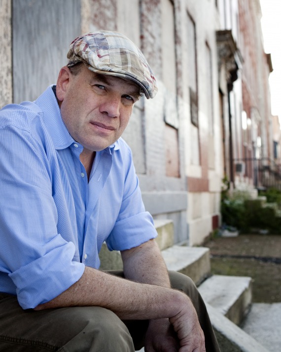 David Simon sitting outside wearing an Irish driver cap