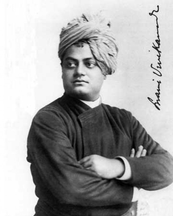 Black and white photograph of a man in a turban with his arms crossed