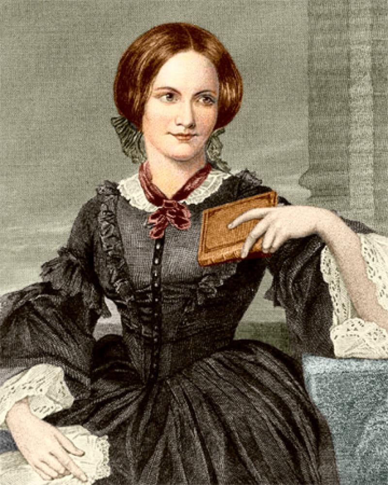 Color image of English novelist Charlotte Brontë with book in hand.