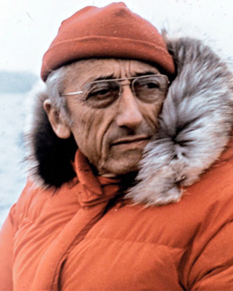 Color photograph of French oceanic explorer Jacques Cousteau in parka.