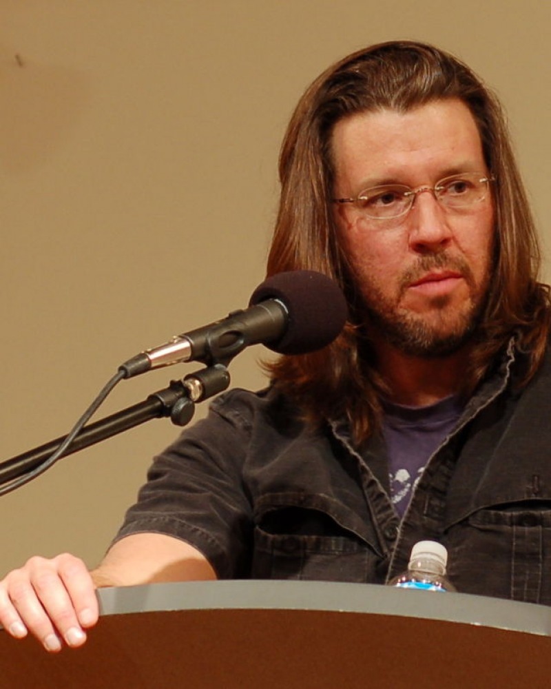 photograph of David Foster Wallace speaking at a podium