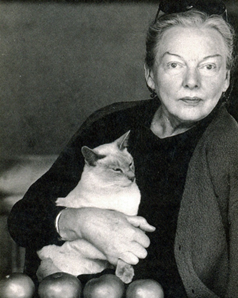 Photograph of American food writer M.F.K. Fisher with cat.