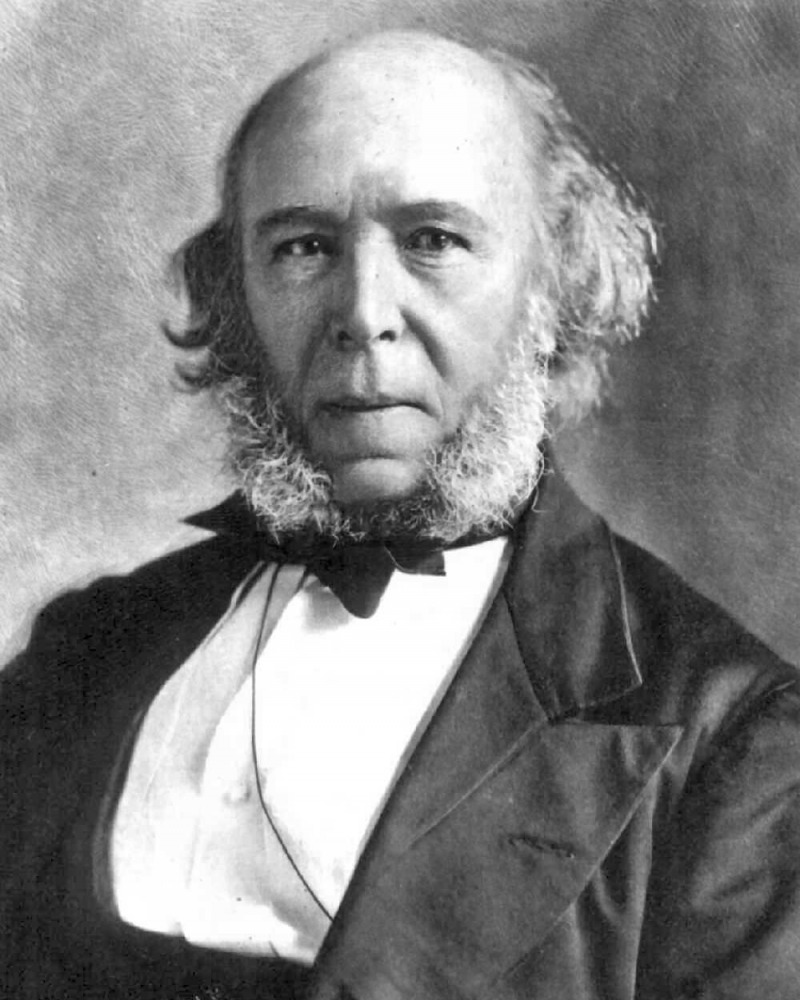 Black and white photo of Herbert Spencer with long, hairy mutton chops and a stern expression