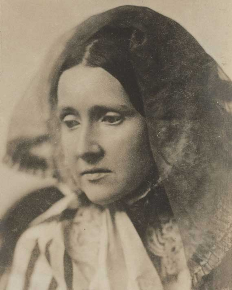 Sepia image of a woman with head veiled