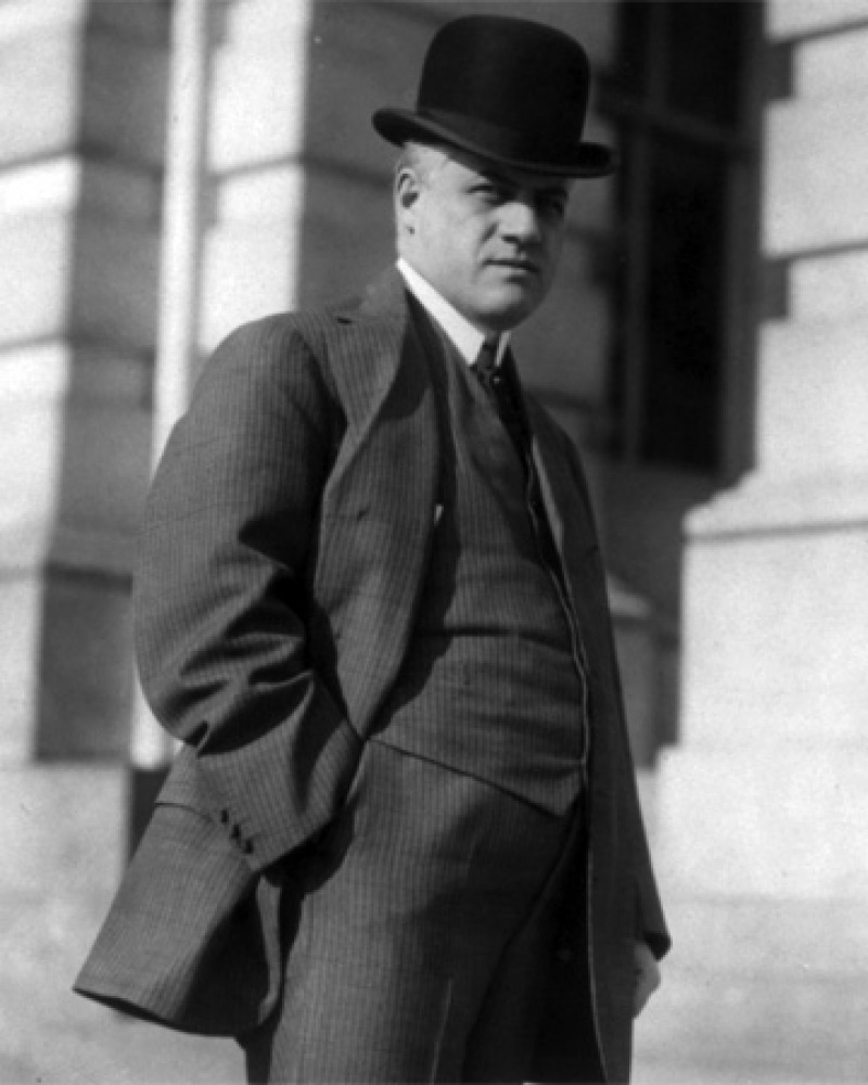 Black and white photograph of former U.S. Attorney General A. Mitchell Palmer with hands in pockets.
