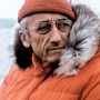 Color photograph of French oceanic explorer Jacques Cousteau in parka.