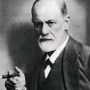 Black and white photograph of Austrian neurologist Sigmund Freud with cigar.