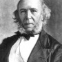 Black and white photo of Herbert Spencer with long, hairy mutton chops and a stern expression