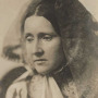 Sepia image of a woman with head veiled