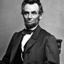 Photograph of President Abraham Lincoln sitting in a chair.