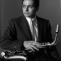 Photograph of American jazz musician Art Pepper with saxophone.