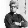 Black and white photograph of a man in a turban with his arms crossed