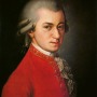 color oil painting of Wolfgang Amadeus Mozart in a red tunic with gray hair
