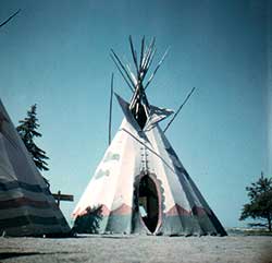 White teepee with decorations at the bottom