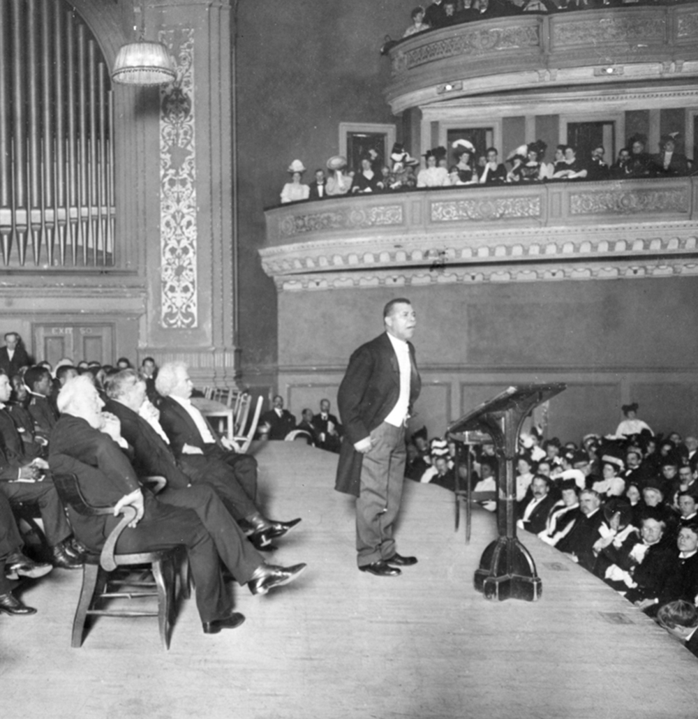 Booker T. Washington holds a Carnegie Hall audience spellbound during his Tuskegee Institute Silver Anniversary lecture, 1906. Wikimedia Commons, The New York Times.