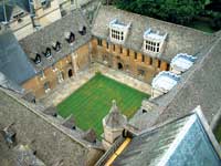 Aerial photograph of a green quadrangle surrounded by buildings